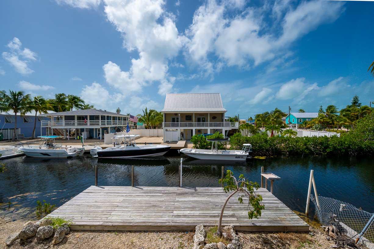27346 Martinique Lane Summerland Key, FL 33042 - Photo 19 of 33 a view of a lake with chairs