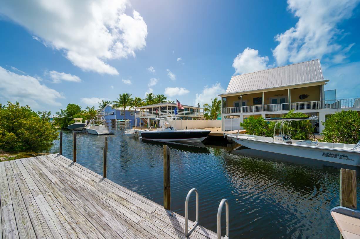 27346 Martinique Lane Summerland Key, FL 33042 - Photo 2 of 33 a house with river in front of it