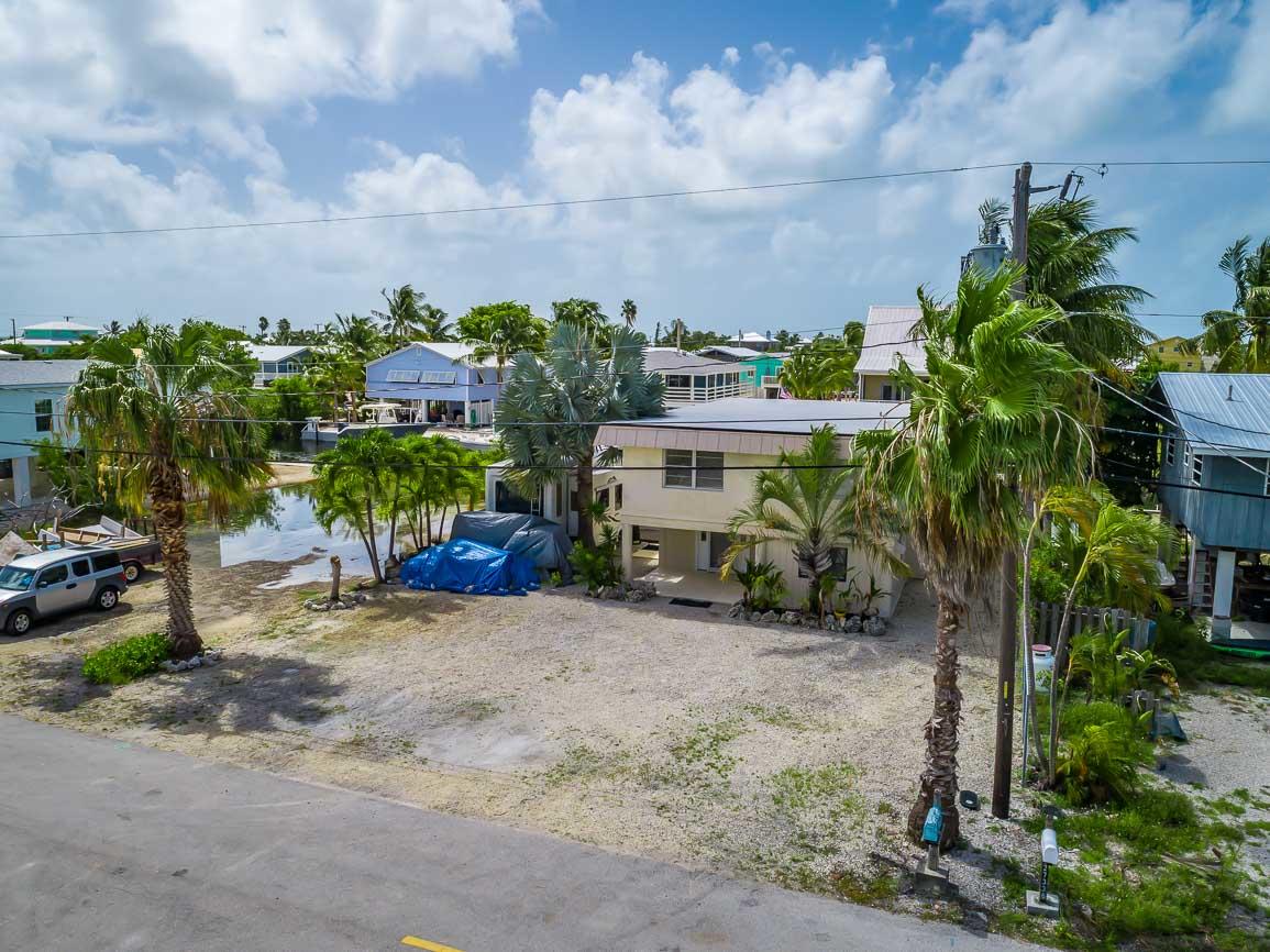 27346 Martinique Lane Summerland Key, FL 33042 - Photo 29 of 33 a view of a house with a yard and sitting area