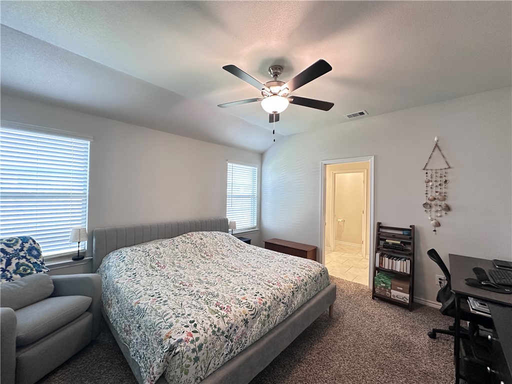 7649 Herd Rider Lane Corpus Christi, TX 78414 - Photo 7 of 18 a bedroom with a bed and furniture