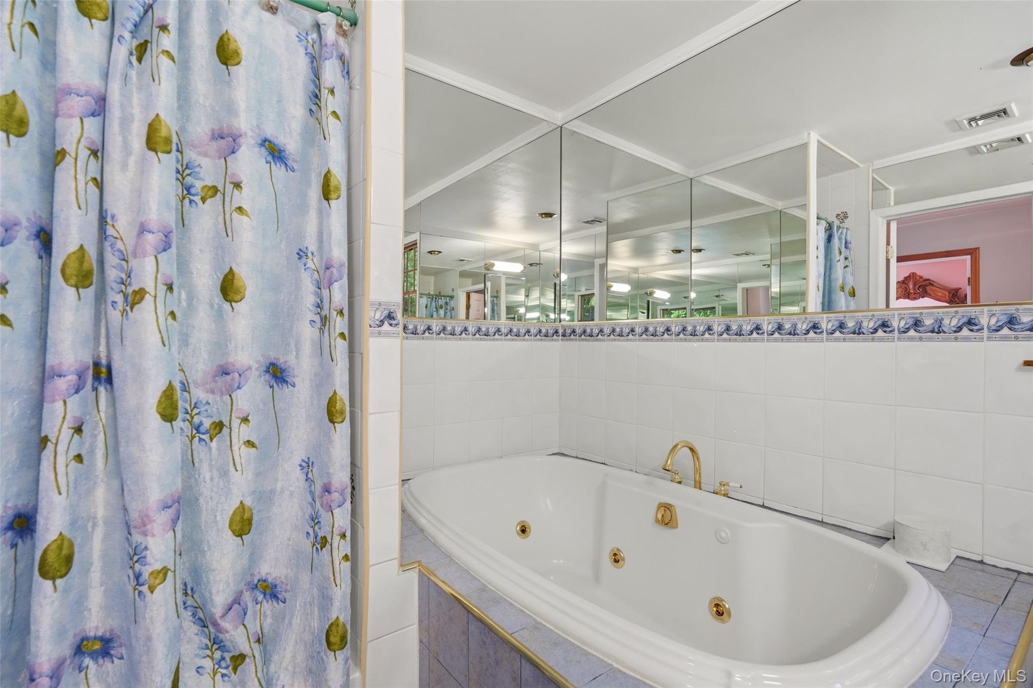623 Cardinal Road Cortlandt Manor, NY 10567 - Photo 25 of 40 a bathroom with a sink and a bathtub
