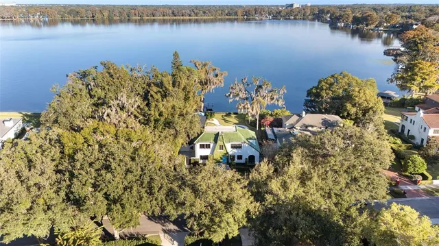 an aerial view of a houses with lake view
