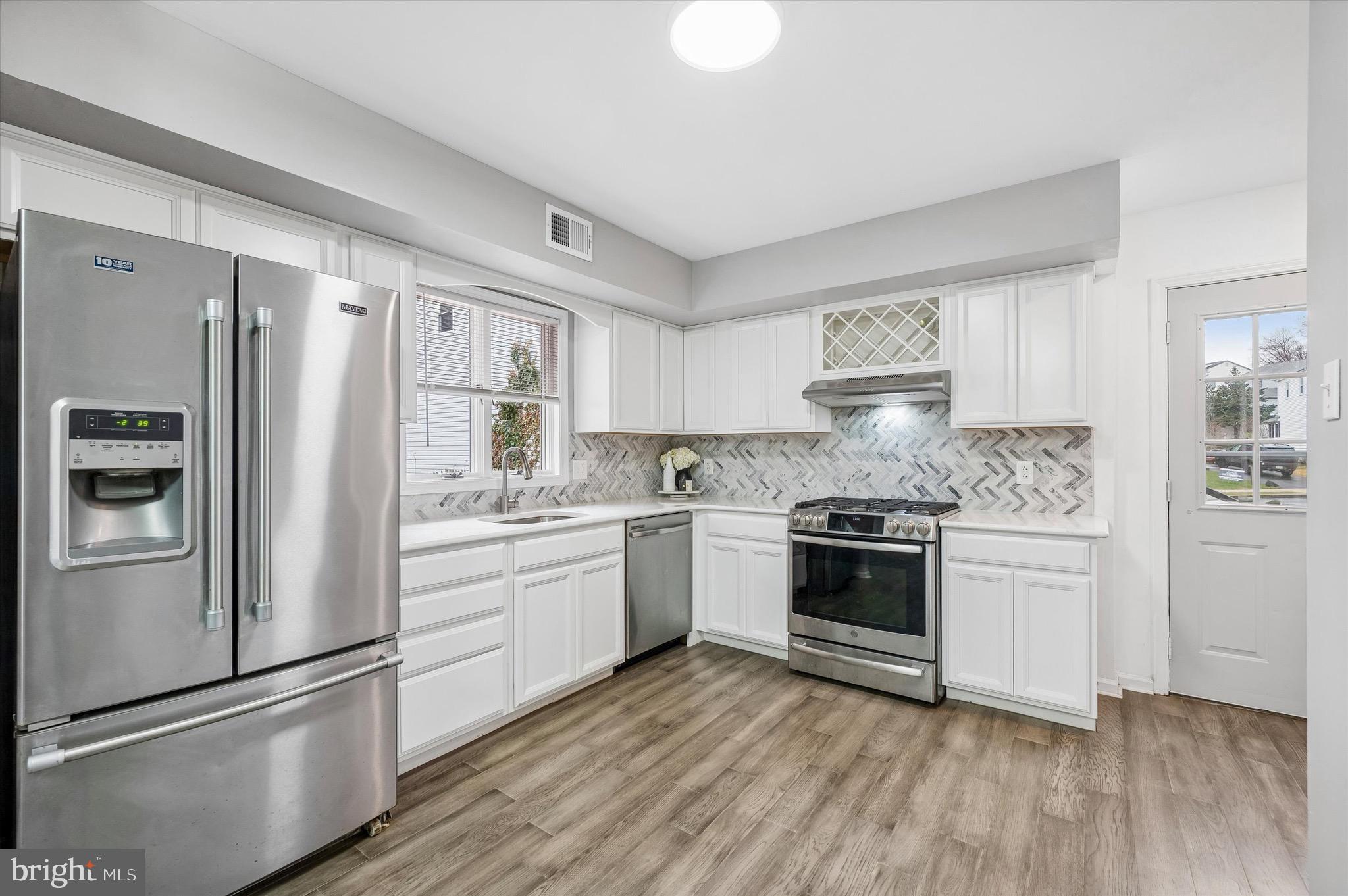 22 East Belair Road Ridley Park, PA 19078 - Photo 11 of 36 a kitchen with a refrigerator stove and sink