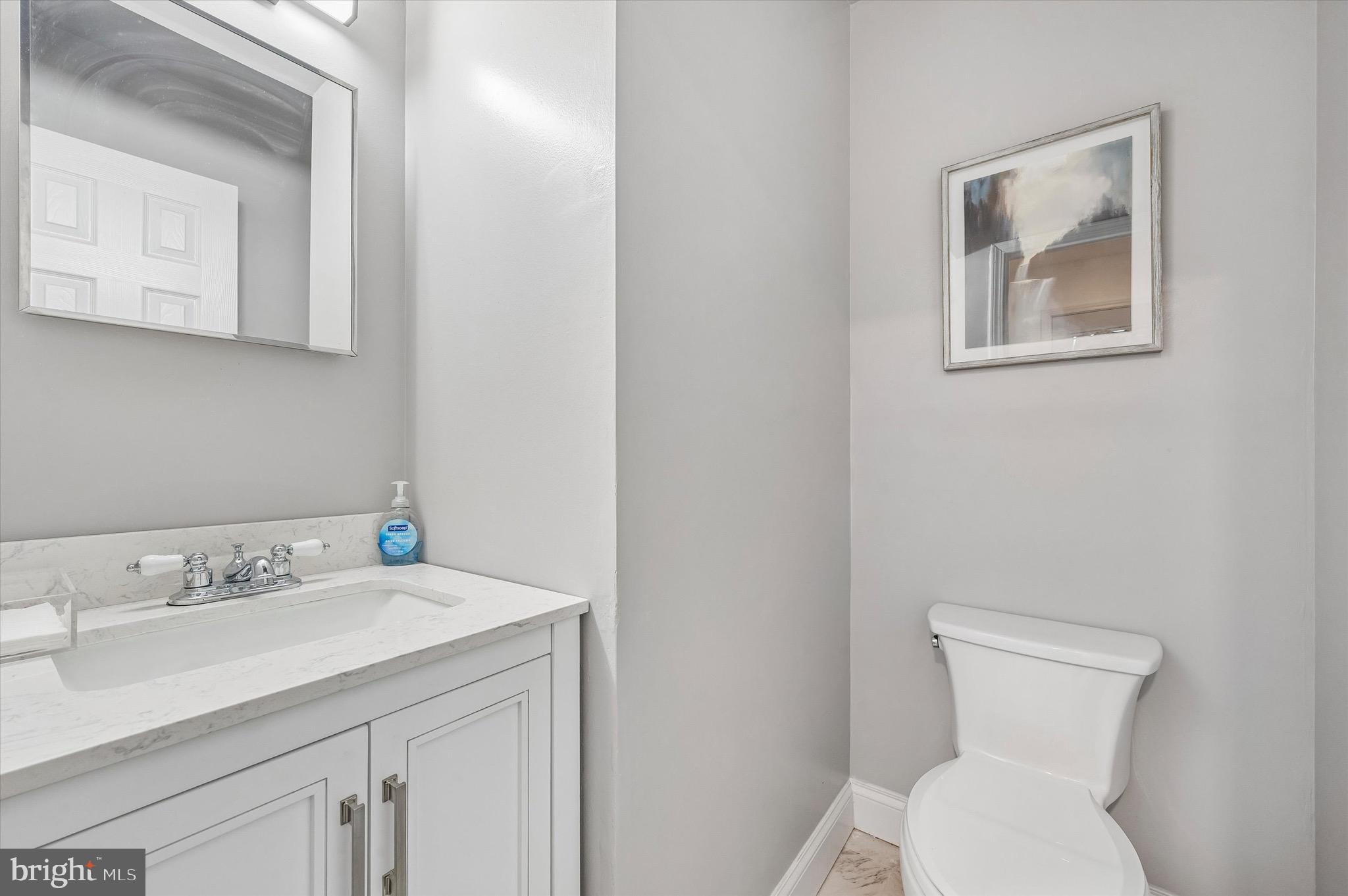22 East Belair Road Ridley Park, PA 19078 - Photo 16 of 36 a bathroom with a toilet sink and mirror