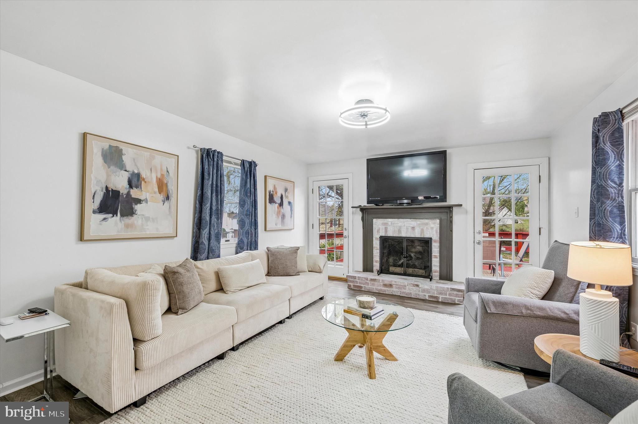 22 East Belair Road Ridley Park, PA 19078 - Photo 17 of 36 a living room with furniture a fireplace and a flat screen tv
