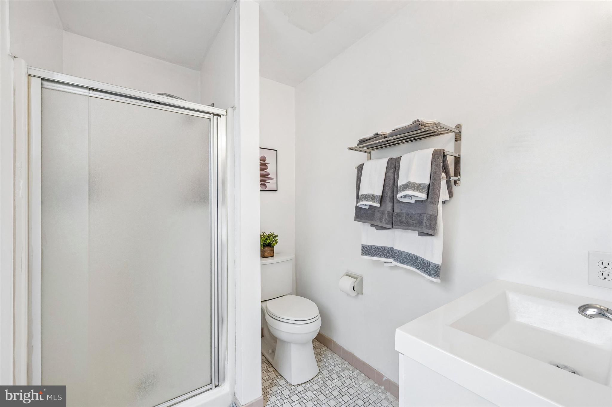 22 East Belair Road Ridley Park, PA 19078 - Photo 23 of 36 a bathroom with a toilet a sink and shower