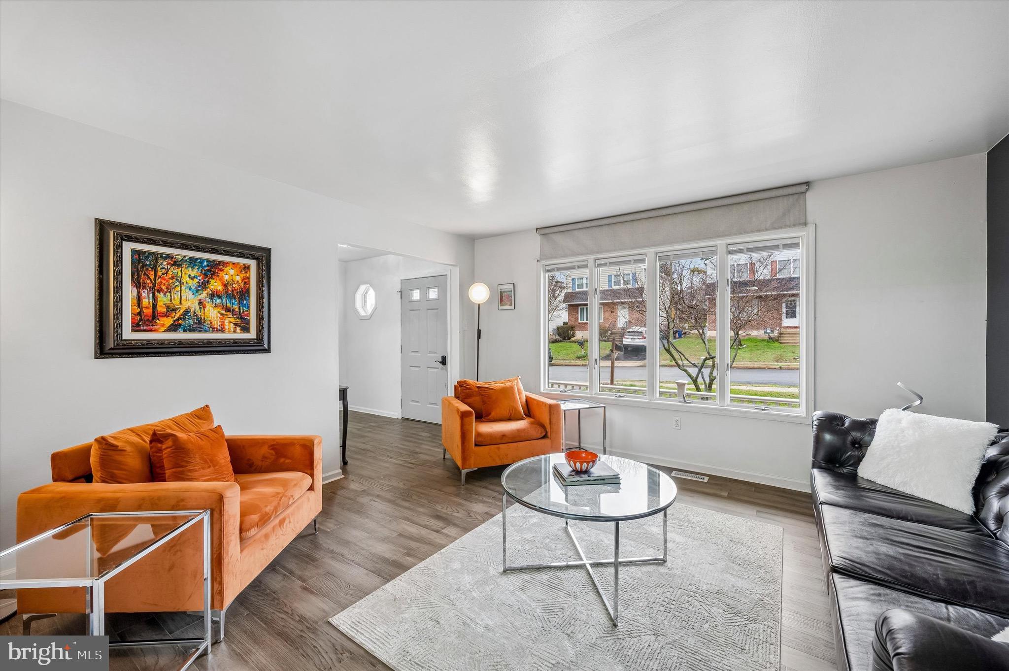 22 East Belair Road Ridley Park, PA 19078 - Photo 7 of 36 a living room with furniture and a large window