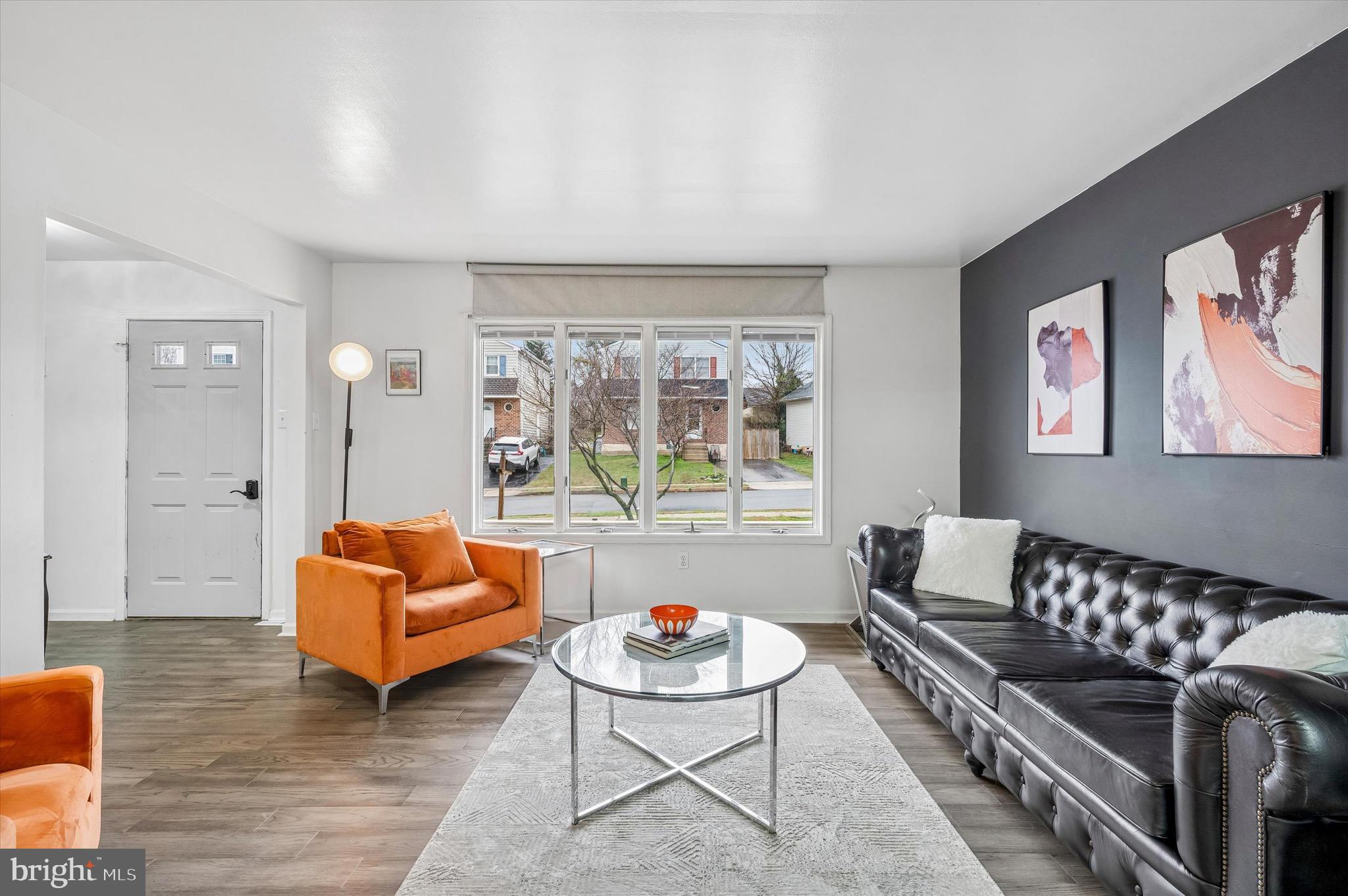 22 East Belair Road Ridley Park, PA 19078 - Photo 8 of 36 a living room with furniture a rug and a large window