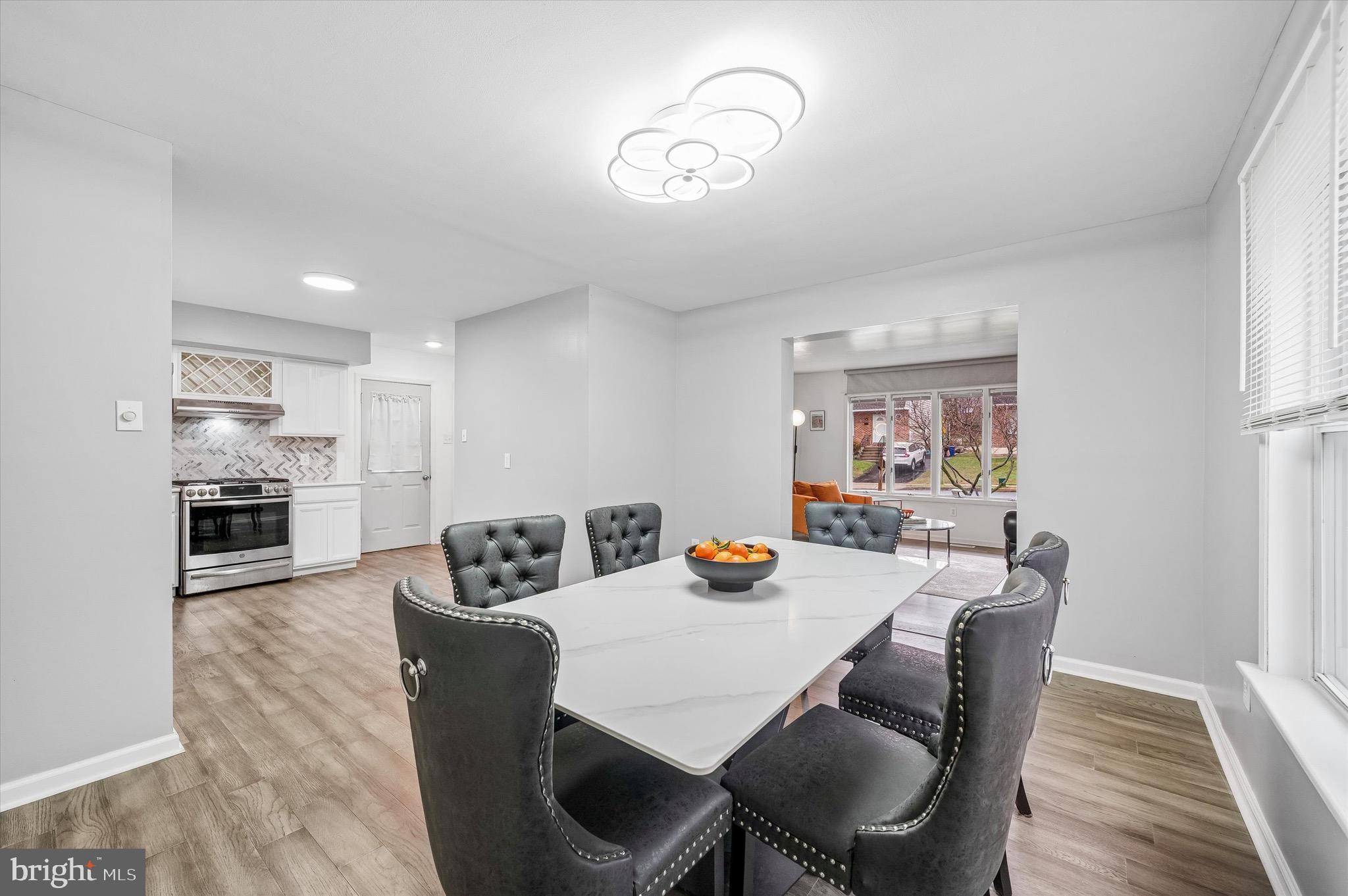 22 East Belair Road Ridley Park, PA 19078 - Photo 10 of 36 a view of a dining room with furniture and wooden floor