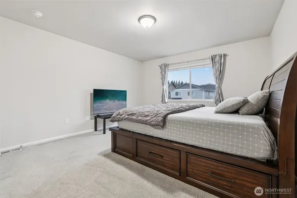 a view of a garden with sitting area