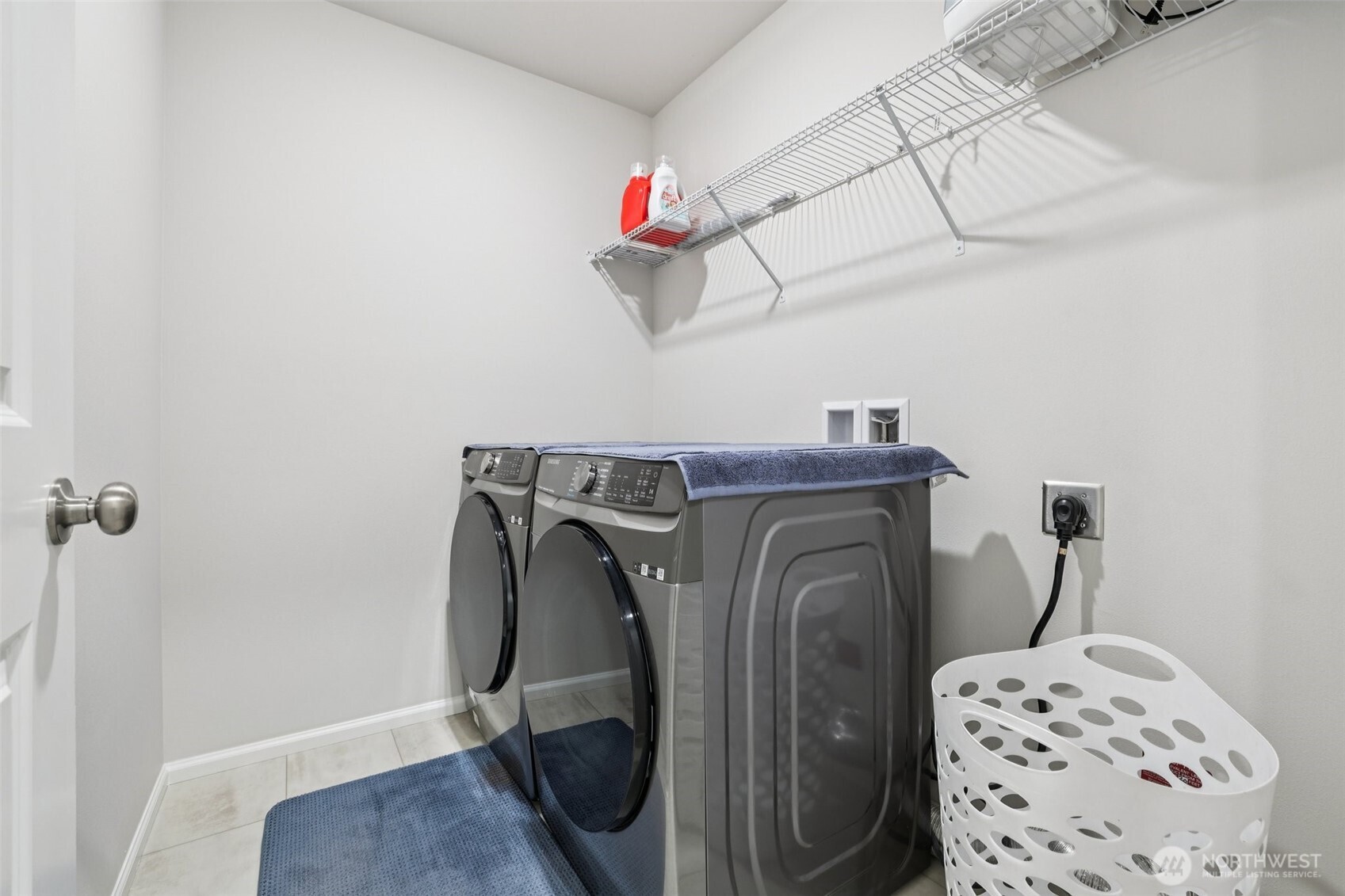 1132 15th Avenue Sultan, WA 98294 - Photo 20 of 26 a view of storage and utility room with racks on the wall