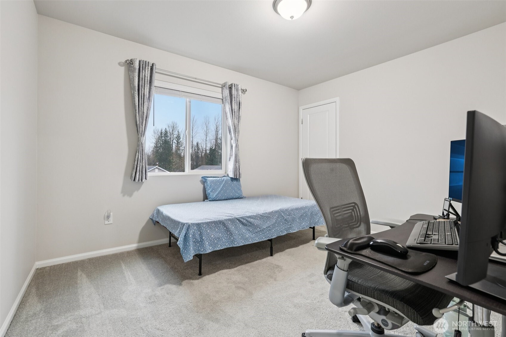 1132 15th Avenue Sultan, WA 98294 - Photo 21 of 26 a living room with furniture and a window