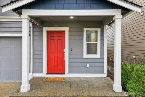 a front view of a house with a garage