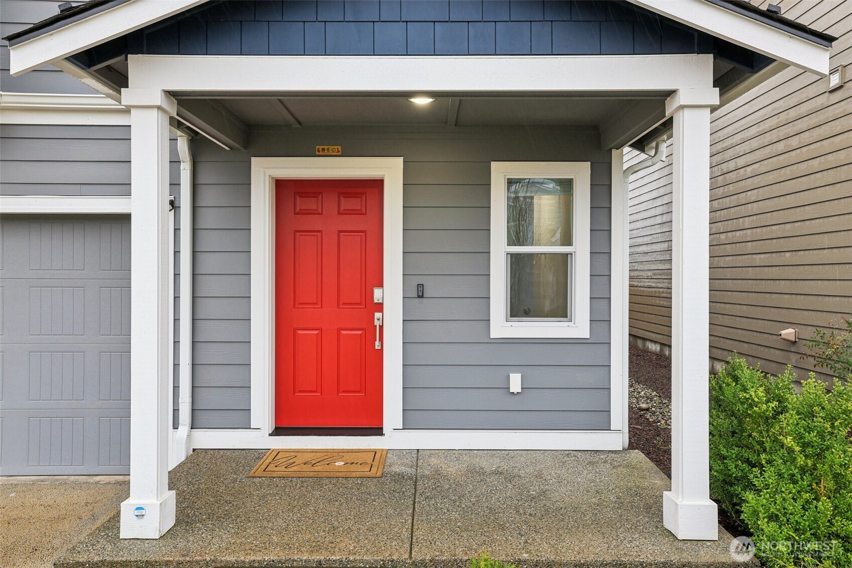 1132 15th Avenue Sultan, WA 98294 - Photo 3 of 26 a front view of a house with a garage