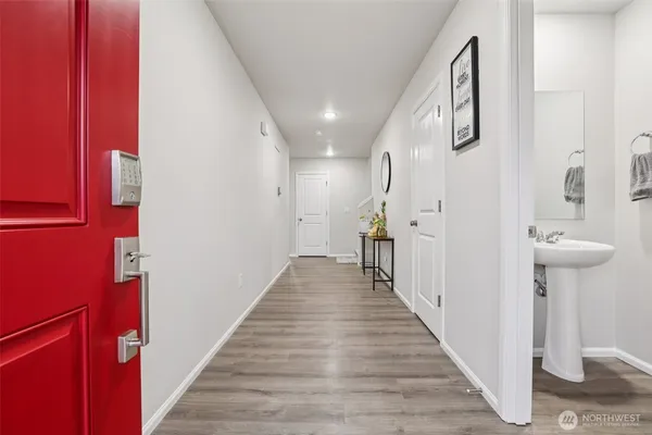 a view of a hallway with seating space