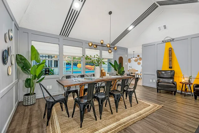 a view of a dining room with furniture and wooden floor