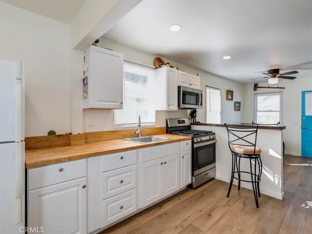 a utility room with a sink dryer and washer