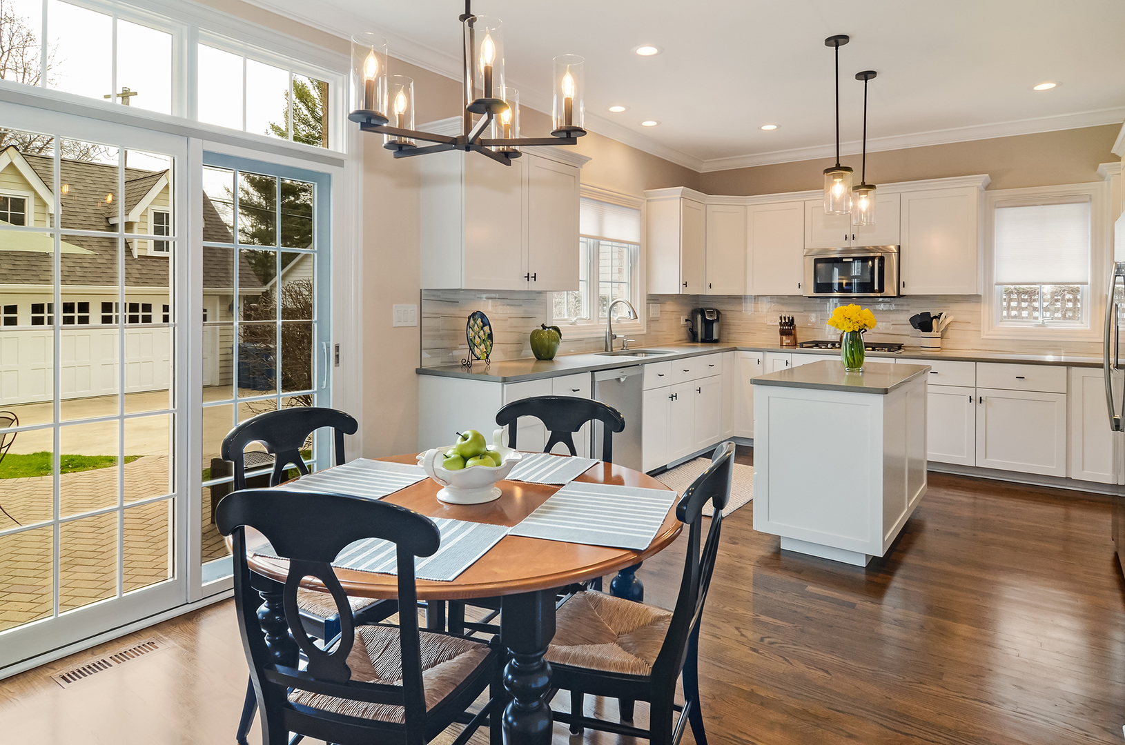307 North County Line Road Hinsdale, IL 60521 - Photo 7 of 31 a kitchen with a dining table chairs and stove