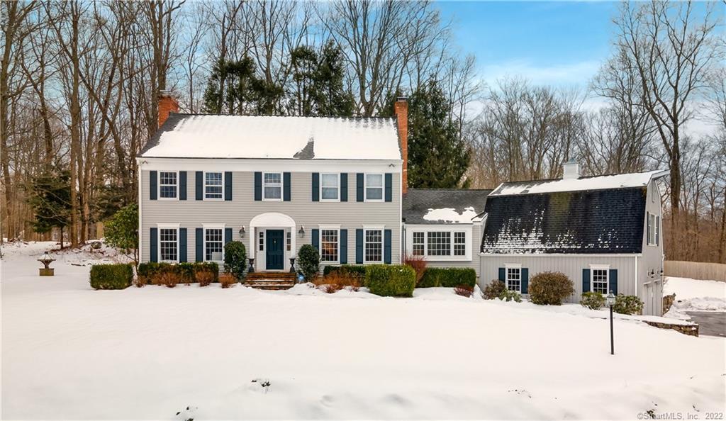 3 Hunter Lane West Ridgefield, CT 06877 - Photo 1 of 1 a front view of a house with a yard covered in snow