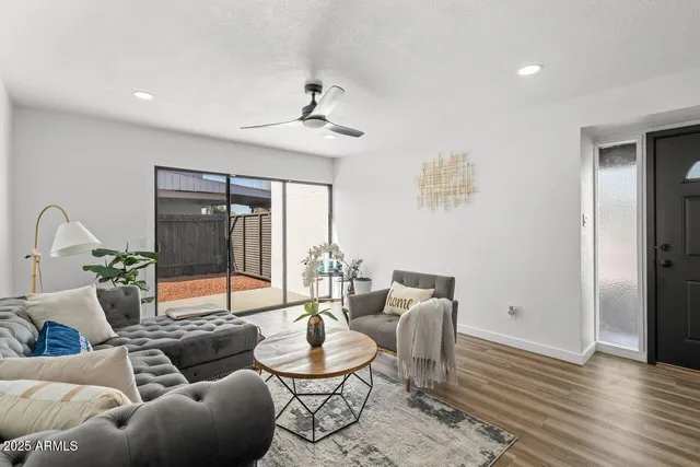 a kitchen with granite countertop white cabinets sink and stainless steel appliances
