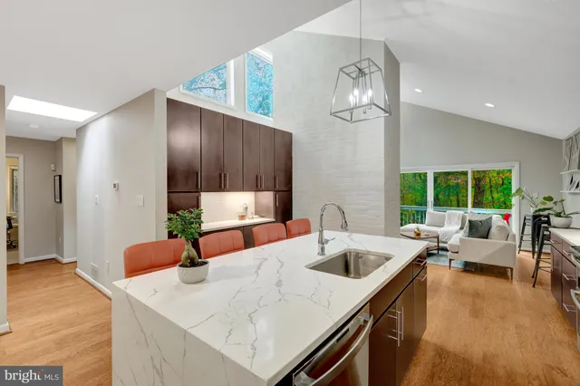 a kitchen with a table chairs and couches