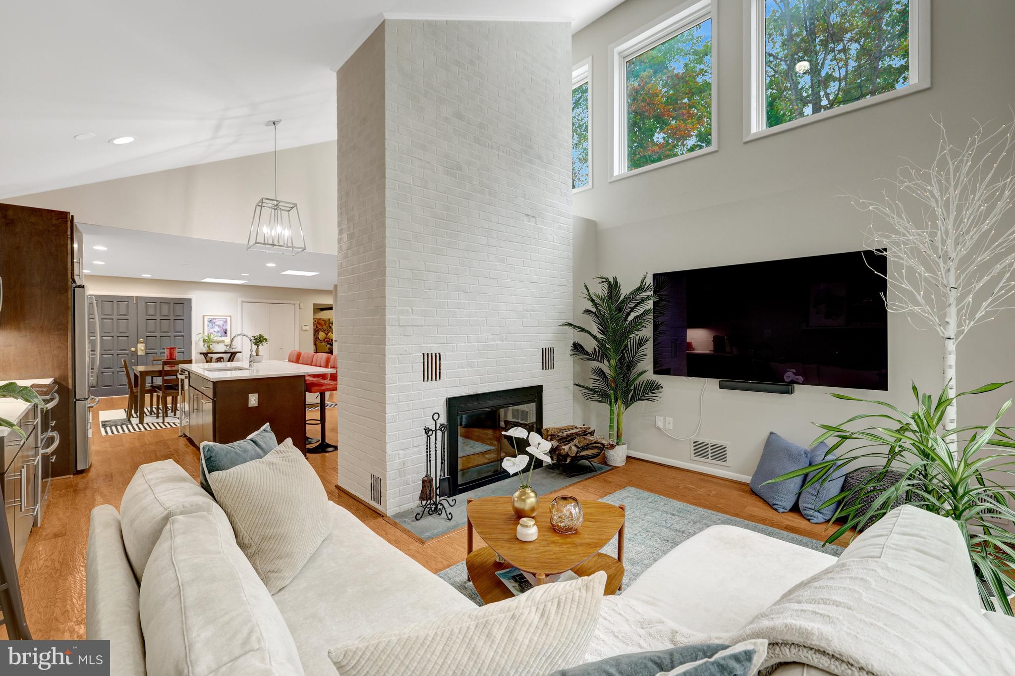 526 Springvale Road Great Falls, VA 22066 - Photo 16 of 55 a living room with furniture a flat screen tv and a fireplace