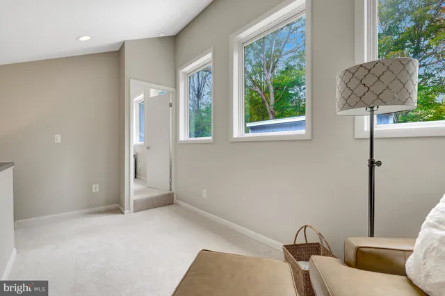 a view of a livingroom with furniture and a window