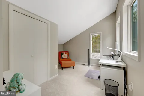 a bedroom with bed and window