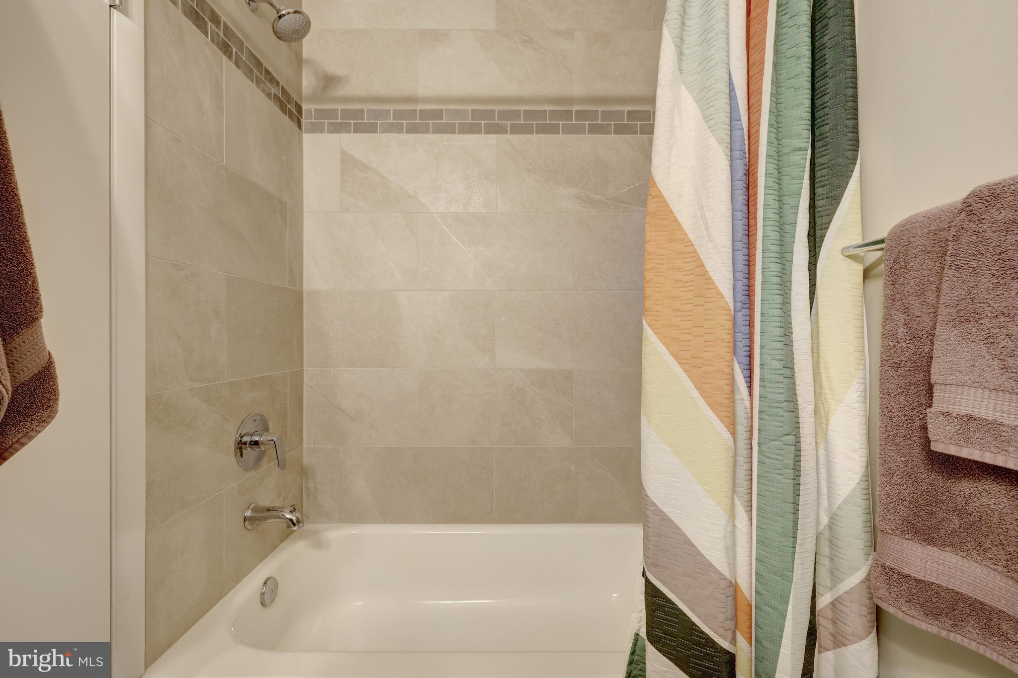 526 Springvale Road Great Falls, VA 22066 - Photo 34 of 55 a bathroom with a bathtub and a shower