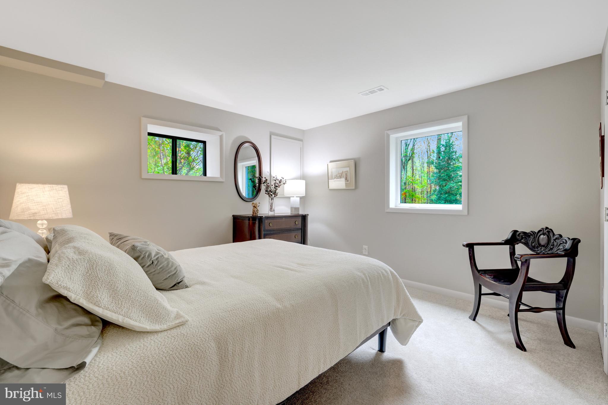 526 Springvale Road Great Falls, VA 22066 - Photo 39 of 55 a bedroom with a bed and a window