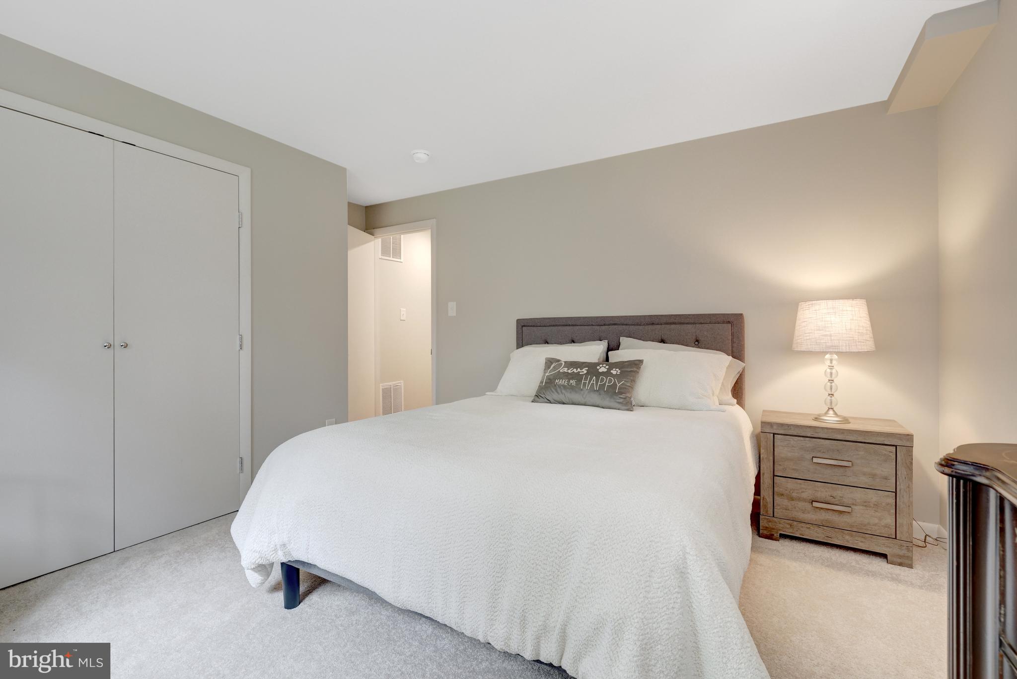 526 Springvale Road Great Falls, VA 22066 - Photo 40 of 55 a bedroom with a bed and a night stand