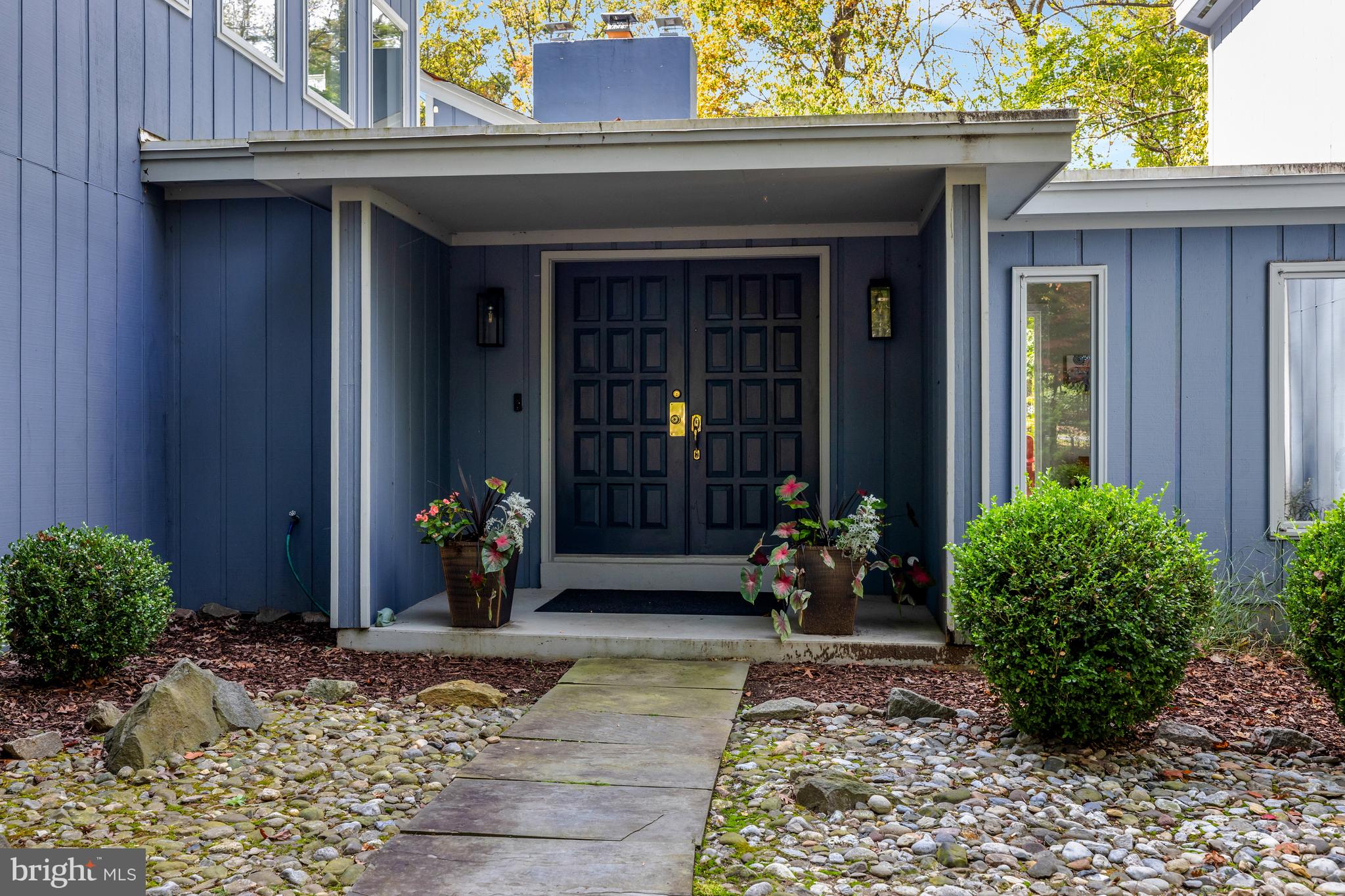 526 Springvale Road Great Falls, VA 22066 - Photo 4 of 55 a view of a house with chair and potted plants