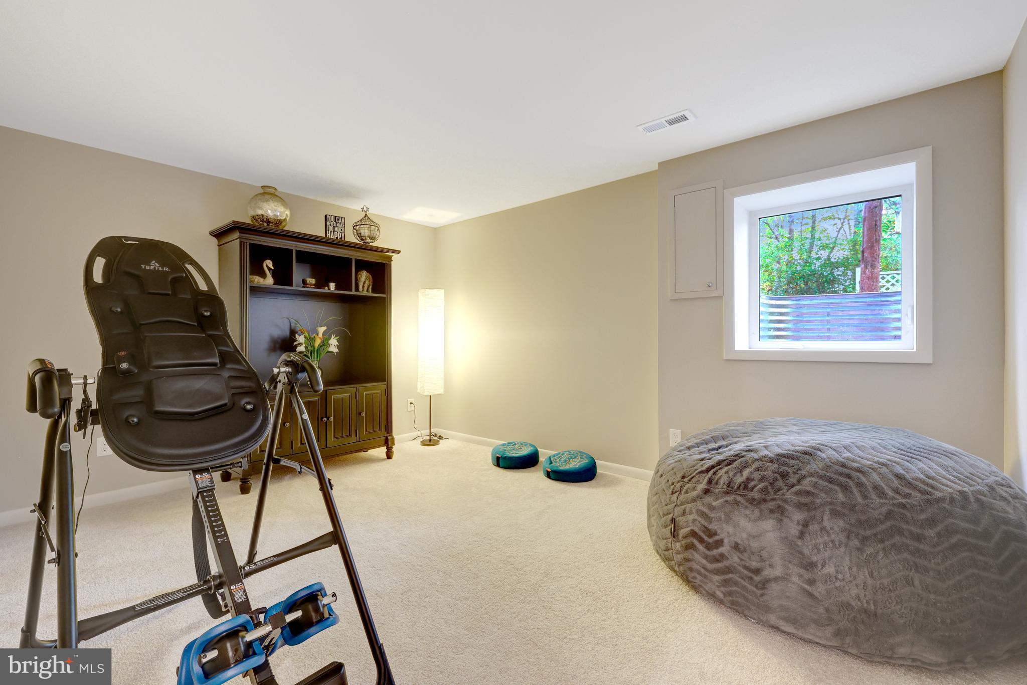 526 Springvale Road Great Falls, VA 22066 - Photo 43 of 55 a bedroom with a bed and a chandelier