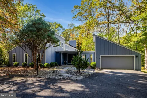 a view of a two chairs in the patio