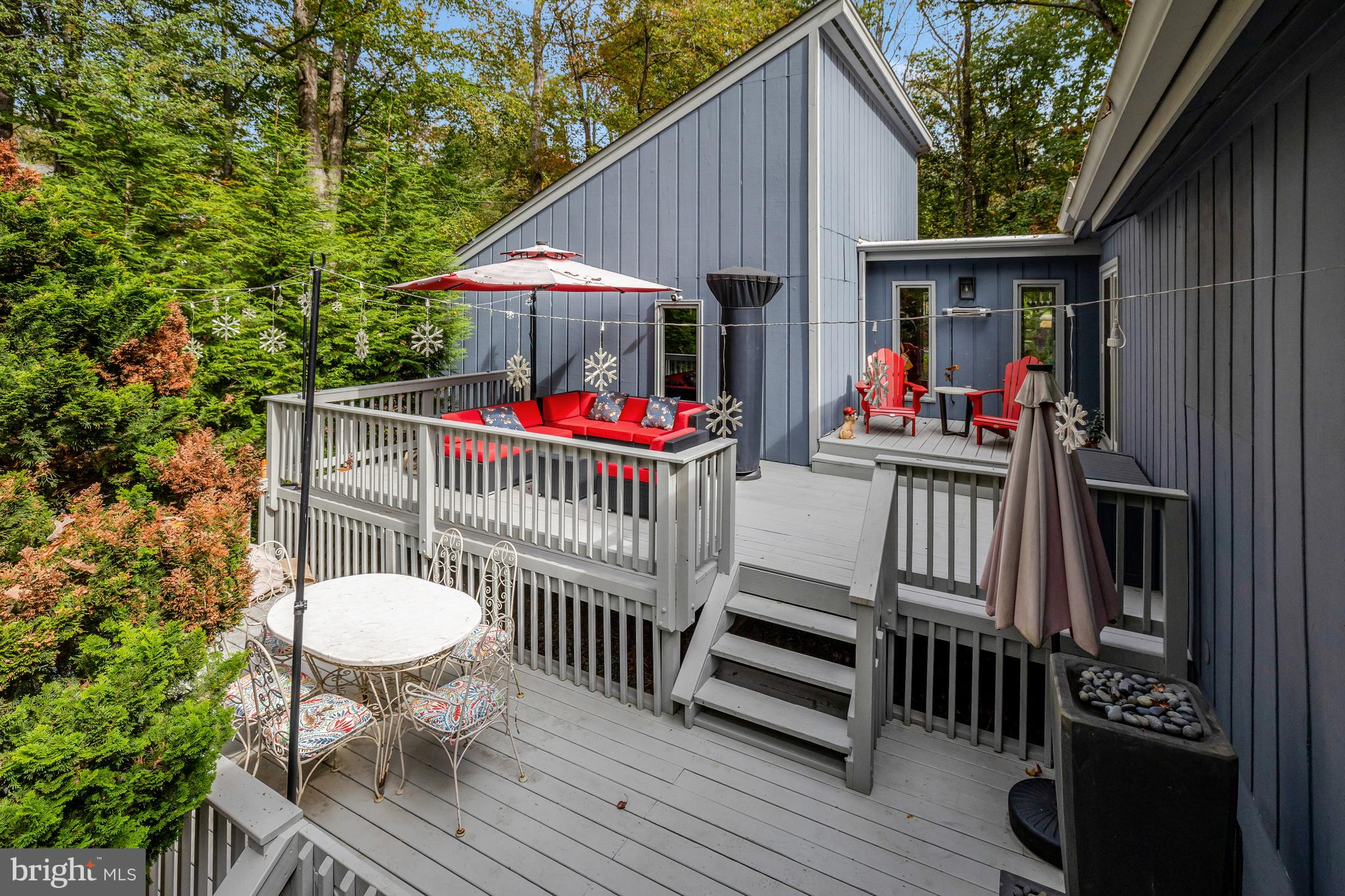 526 Springvale Road Great Falls, VA 22066 - Photo 46 of 55 a view of a chairs and table in patio with wooden floor and fence