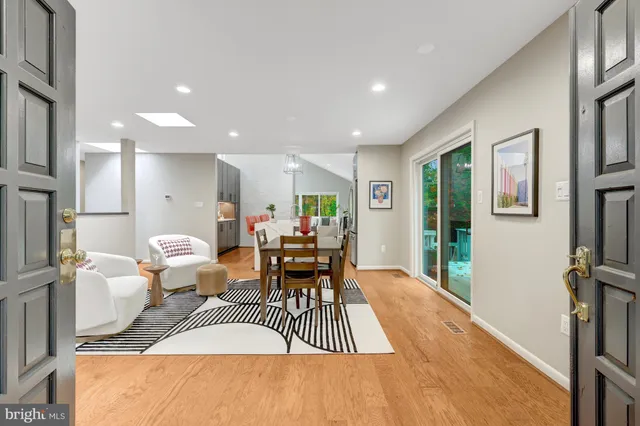 a living room with furniture a window and a table