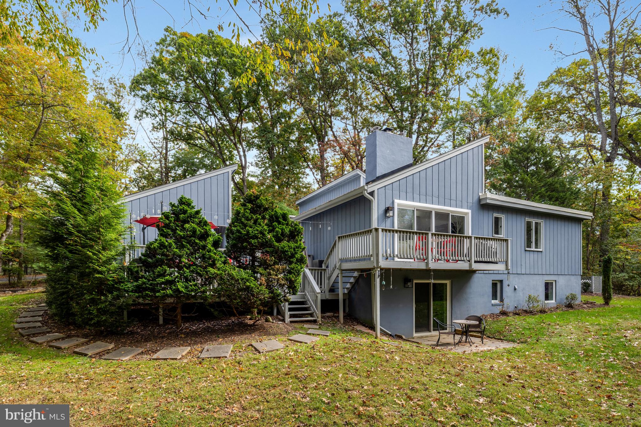 526 Springvale Road Great Falls, VA 22066 - Photo 51 of 55 a view of a house with wooden deck and a tree