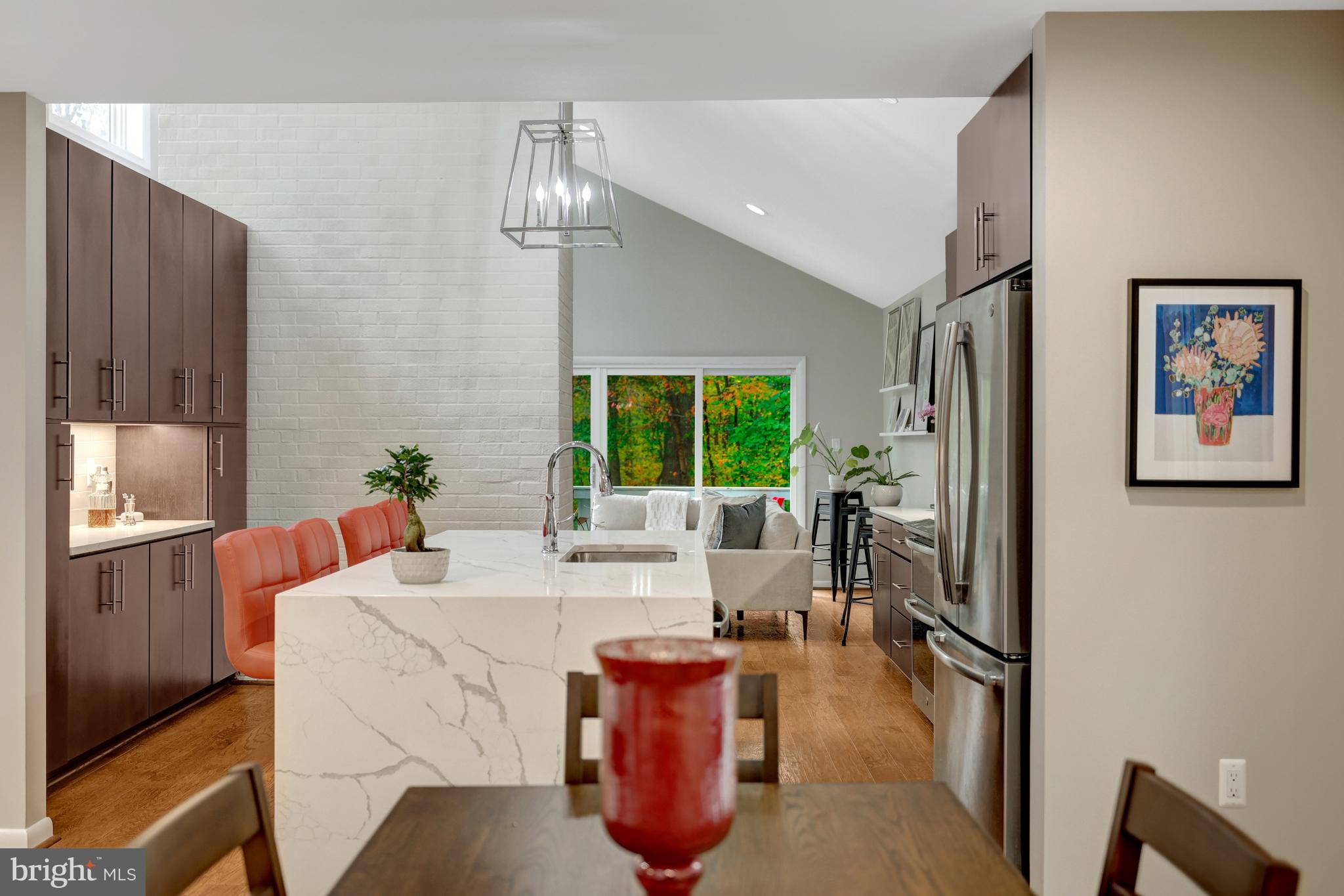 526 Springvale Road Great Falls, VA 22066 - Photo 9 of 55 a living room with furniture chandelier and a window