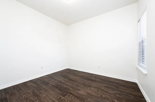 a view of a small space with wooden floor