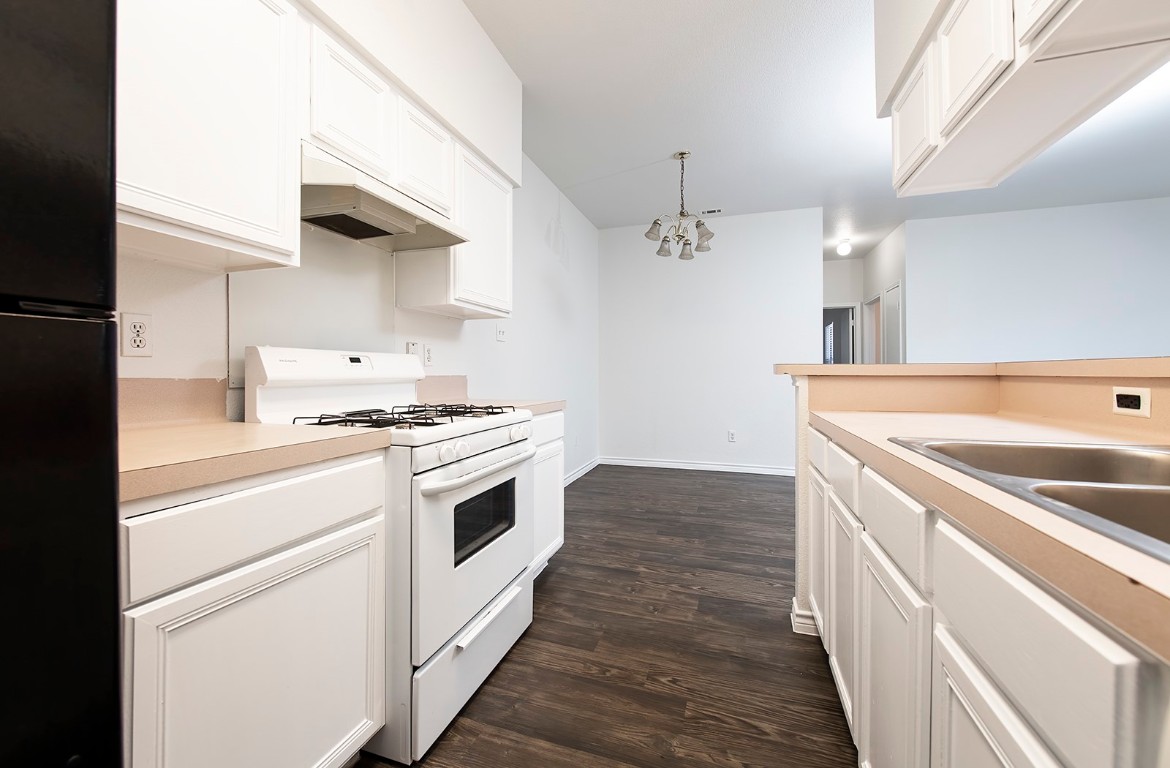 322 Tamara Drive, Unit A Georgetown, TX 78628 - Photo 10 of 17 a kitchen with a stove and a sink