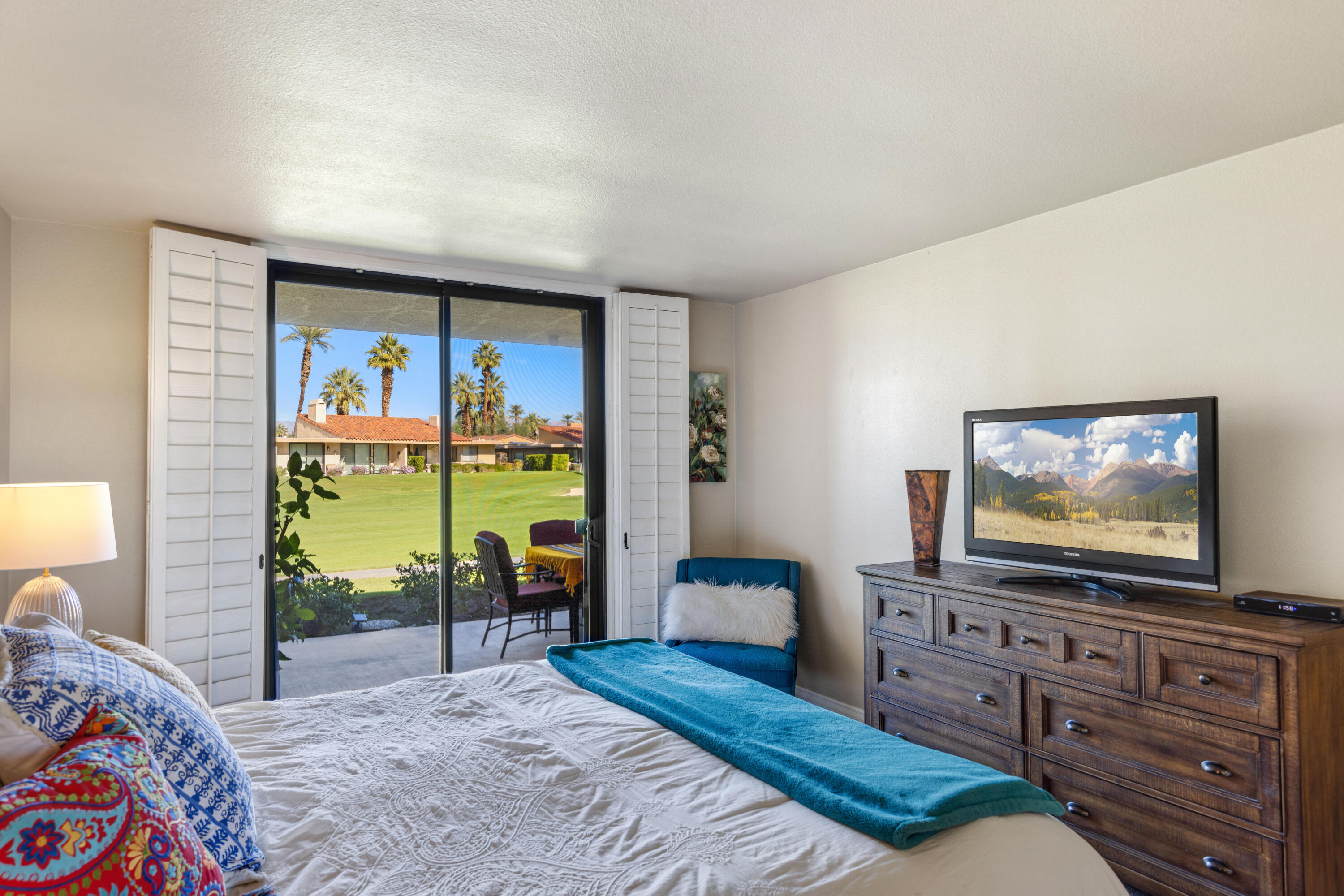 10 La Cerra Circle Rancho Mirage, CA 92270 - Photo 13 of 30 a living room with furniture and a flat screen tv
