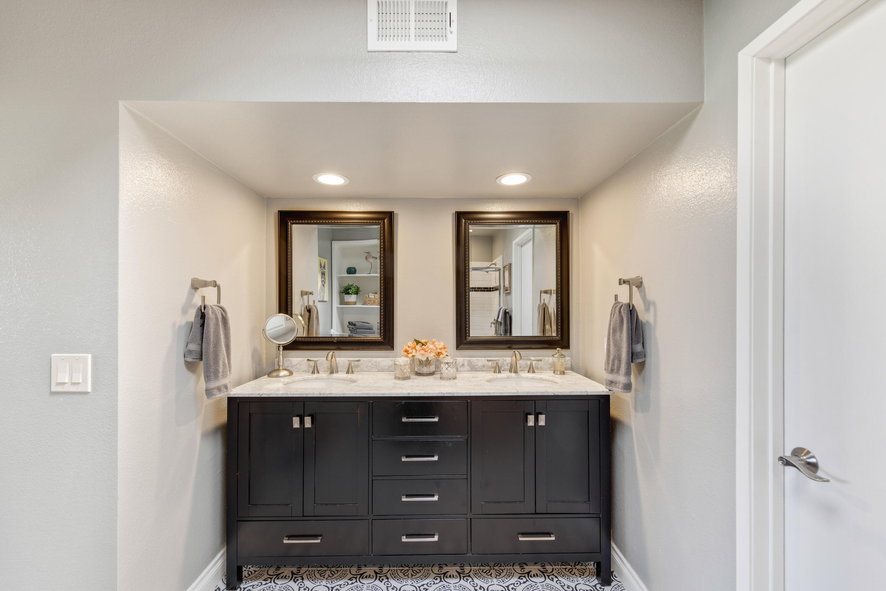 10 La Cerra Circle Rancho Mirage, CA 92270 - Photo 15 of 30 a bathroom with a granite countertop sink a mirror and a shower