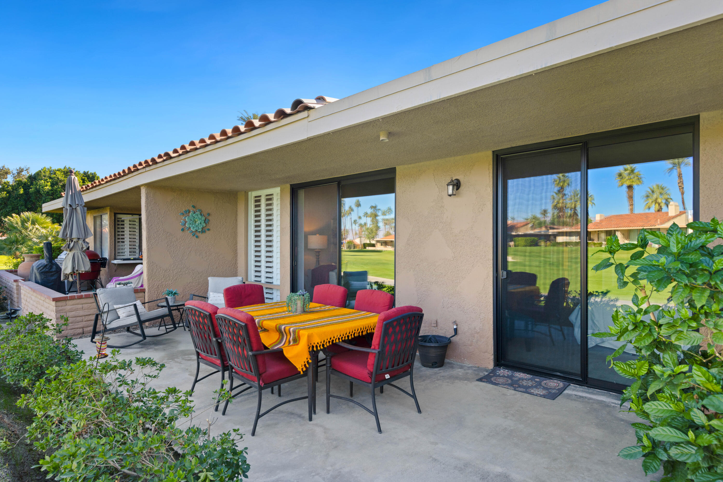 10 La Cerra Circle Rancho Mirage, CA 92270 - Photo 20 of 30 a dining room with furniture and front door