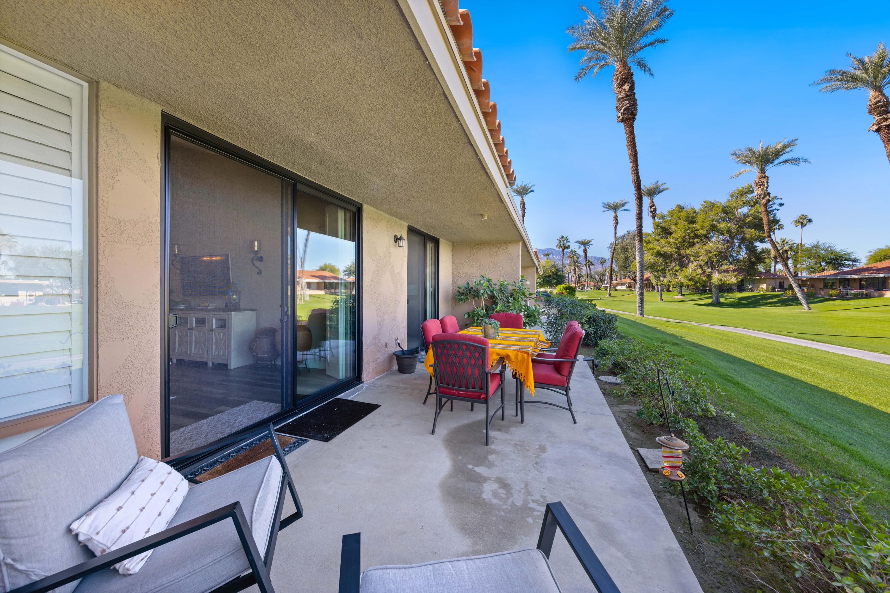 10 La Cerra Circle Rancho Mirage, CA 92270 - Photo 21 of 30 a view of a sitting area with furniture and garden