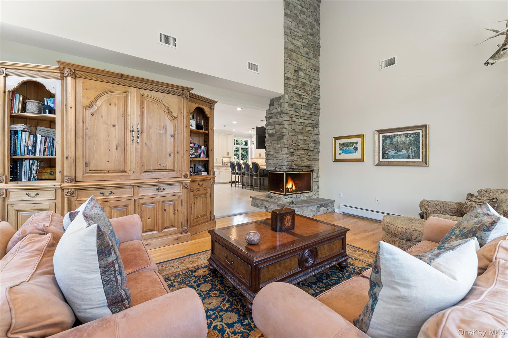 22 Perrin's Peak Road Stony Point, NY 10980 - Photo 36 of 47 Living area featuring a high ceiling, light wood finished floors, and a stone fireplace