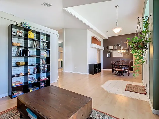 a dining room with furniture and window