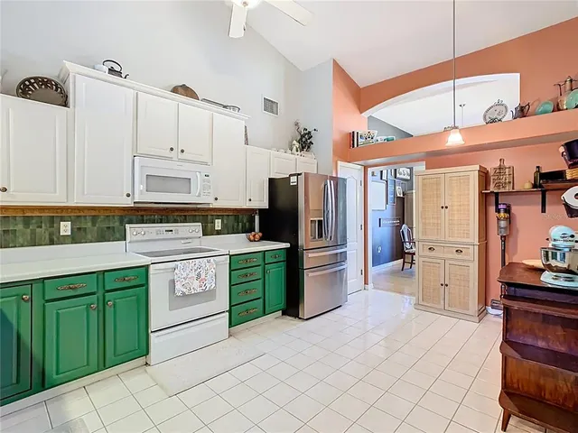 a spacious bedroom with a large bed and a fireplace