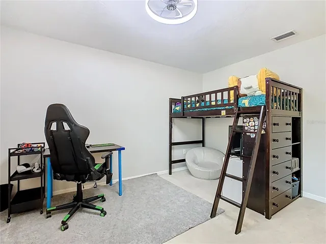 a view of a house with backyard sitting area and garden