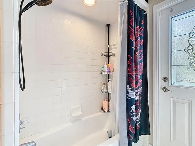 a front view of a house with swimming pool having outdoor seating