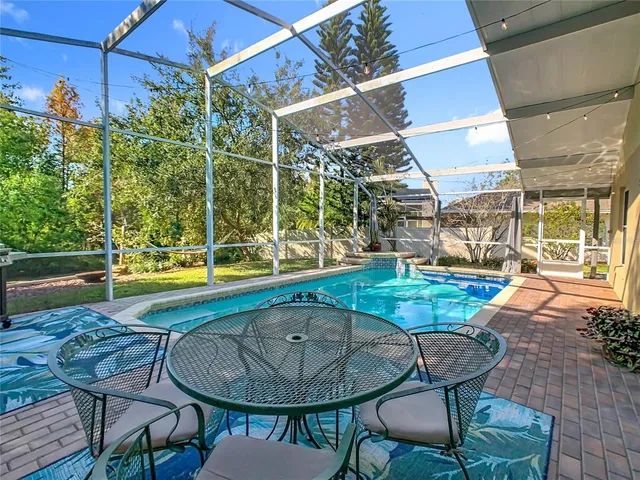 an aerial view of residential houses with outdoor space and street view